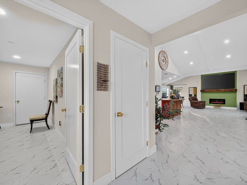 The bedroom hallway, with wide doorways opening toward the great room