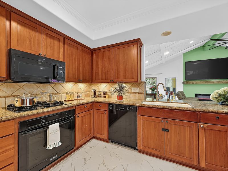 The kitchen peninsula and sink, open to the great room